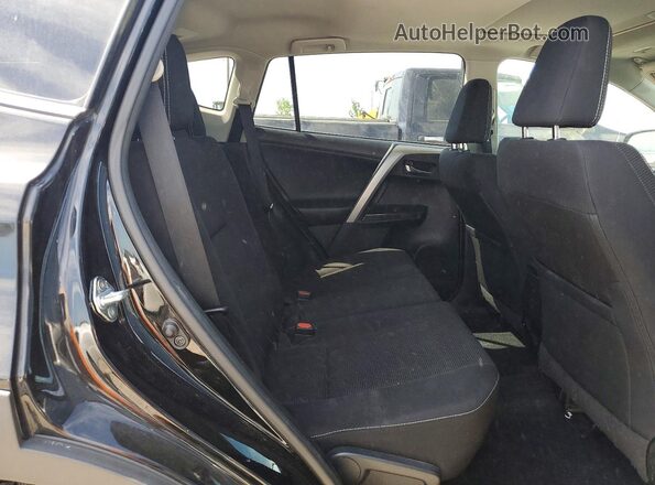 2T3RFREV2JW697862 2018 TOYOTA RAV4 Черный Вид задней части салона