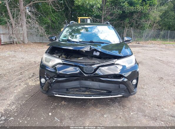 2T3RFREV3GW462444 2016 TOYOTA RAV4 Black Vista interior trasera