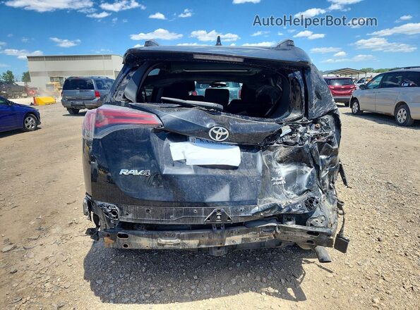 2T3RFREV4JW704794 2018 TOYOTA RAV4 Black Vista trasera