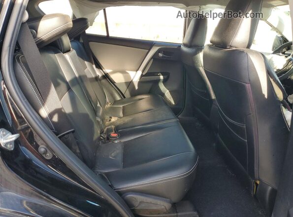 2T3RFREV4JW709770 2018 TOYOTA RAV4 Black Rear interior view