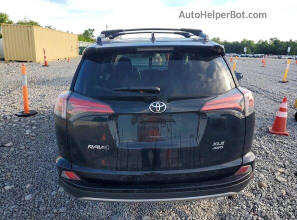 2T3RFREV4JW709770 2018 TOYOTA RAV4 Black Rear view