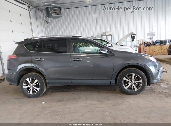 2T3RFREV4JW734622 2018 TOYOTA RAV4 Gray Widok wnętrza z tyłu
