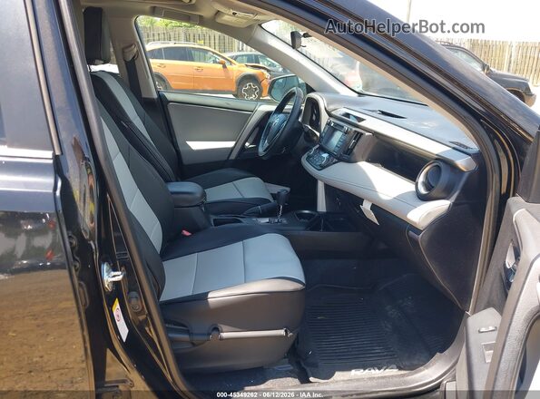 2T3RFREV5GW463966 2016 TOYOTA RAV4 Black წინა სალონის ხედი