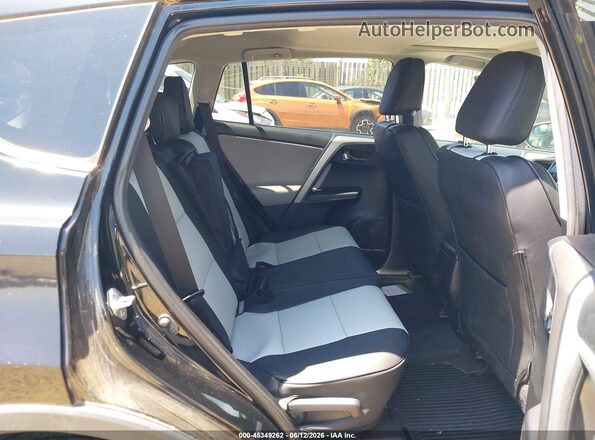 2T3RFREV5GW463966 2016 TOYOTA RAV4 Black VIN კოდის სტიკერის ხედი