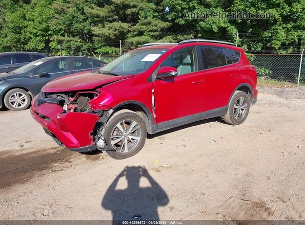 2T3RFREV5GW531263 2016 TOYOTA RAV4 Red Vista tres cuartos delantera izquierda