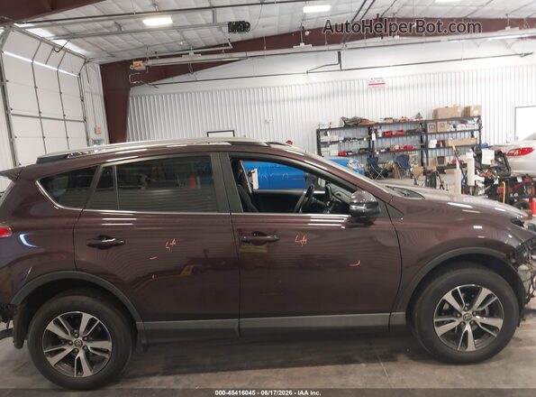 2T3RFREV6JW760090 2018 TOYOTA RAV4 Burgundy Widok wnętrza z tyłu