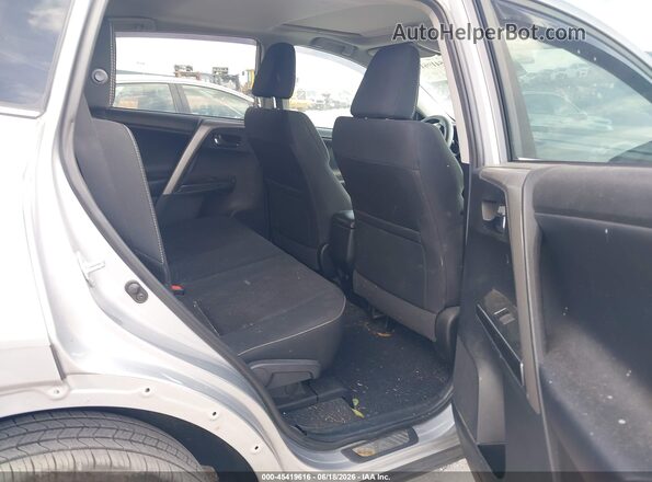 2T3RFREV7JW696092 2018 TOYOTA RAV4 Silver VIN კოდის სტიკერის ხედი