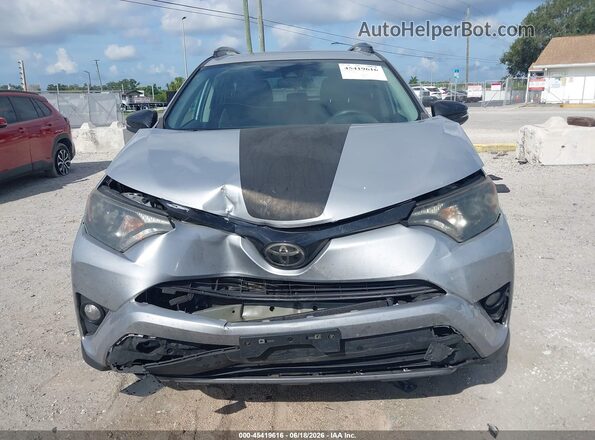 2T3RFREV7JW696092 2018 TOYOTA RAV4 Silver ხელსაწყოთა პანელის ხედი