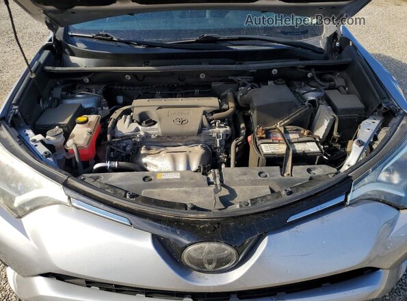 2T3RFREV7JW816330 2018 TOYOTA RAV4 Silver Rear interior view