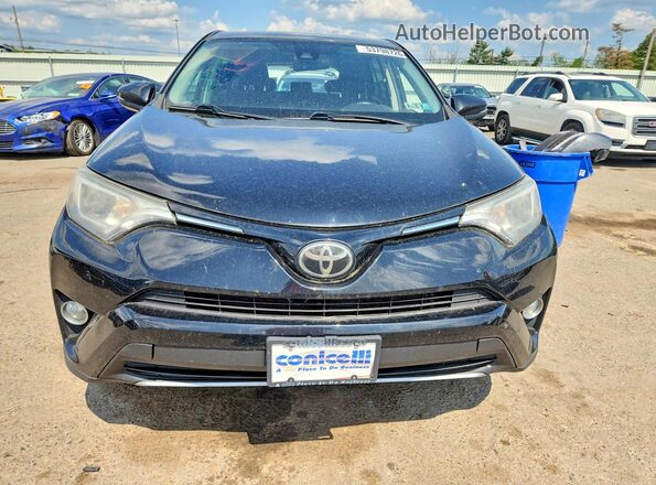 2T3RFREV8JW706080 2018 TOYOTA RAV4 Black Widok z przodu
