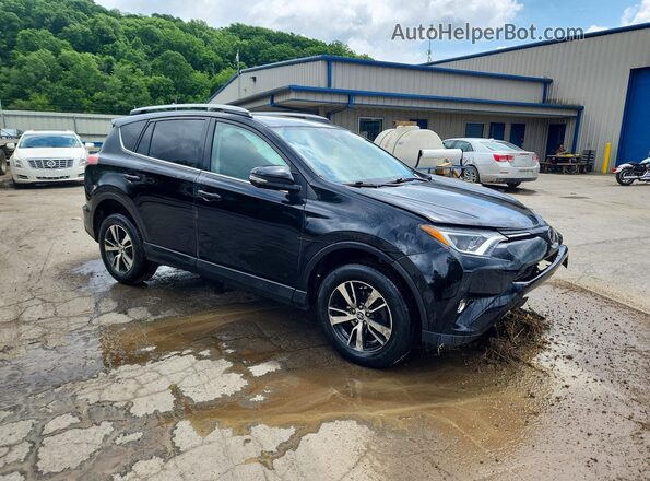 2T3RFREV8JW831886 2018 TOYOTA RAV4 Black Front right