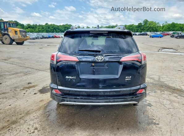 2T3RFREV8JW831886 2018 TOYOTA RAV4 Black Rear view
