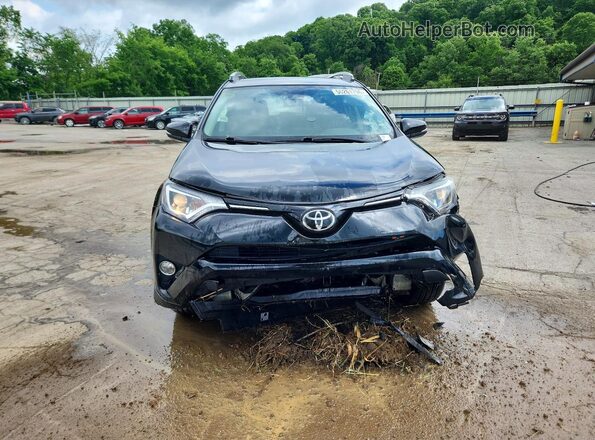 2T3RFREV8JW831886 2018 TOYOTA RAV4 Black Front view
