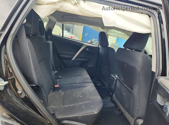 2T3RFREV8JW831886 2018 TOYOTA RAV4 Black Rear interior view