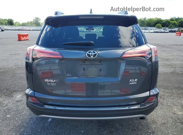 2T3RFREV8JW832066 2018 TOYOTA RAV4 Gray Vista trasera