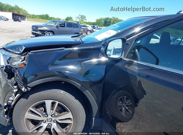 2T3RFREV9JW713233 2018 TOYOTA RAV4 Black Вид спереду