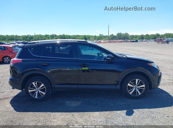 2T3RFREV9JW713233 2018 TOYOTA RAV4 Black Вид задньої частини салону