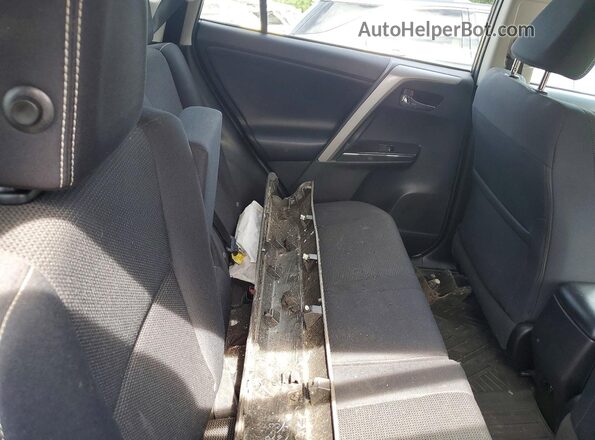 2T3RFREV9JW774971 2018 TOYOTA RAV4 Gray Vista interior trasera