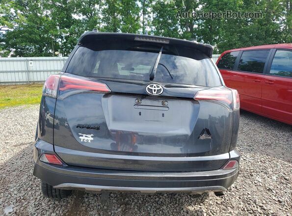 2T3RFREV9JW774971 2018 TOYOTA RAV4 Gray Vista trasera
