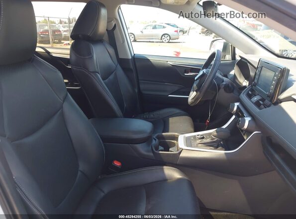 2T3RWRFV5KW025388 2019 TOYOTA RAV4 HYBRID White წინა სალონის ხედი