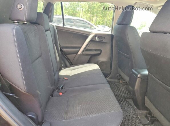 2T3WFREV0GW289968 2016 TOYOTA RAV4 Black Rear interior view