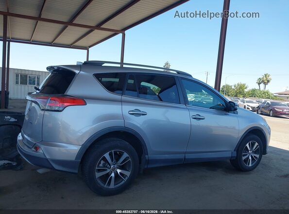 2T3WFREV0JW439052 2018 TOYOTA RAV4 Silver უკანა სალონის ხედი