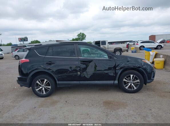 2T3WFREV2GW235698 2016 TOYOTA RAV4 Черный Вид задней части салона