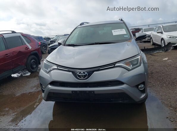 2T3WFREV2GW271813 2016 TOYOTA RAV4 Silver Вид задньої частини салону