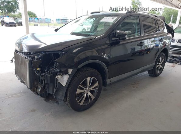 2T3WFREV2GW283511 2016 TOYOTA RAV4 Black Front left