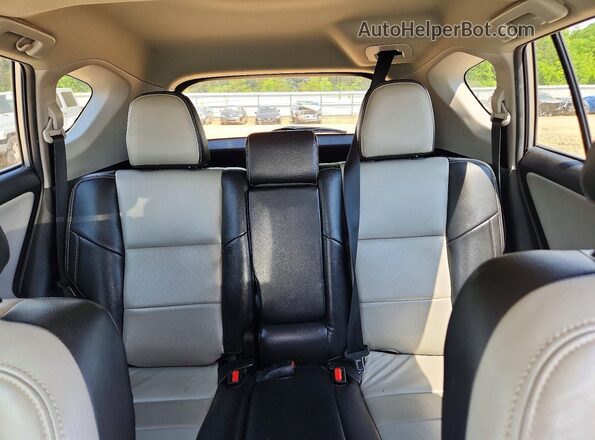 2T3WFREV2HW391791 2017 TOYOTA RAV4 Silver Rear seats view