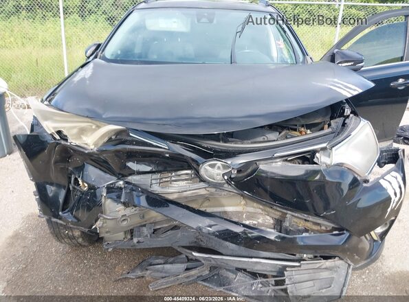 2T3WFREV2JW412516 2018 TOYOTA RAV4 Black Vista trasera