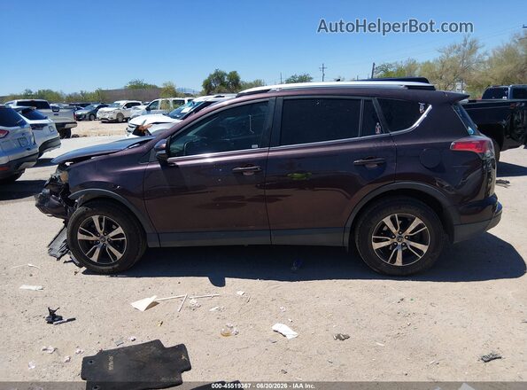 2T3WFREV4GW311504 2016 TOYOTA RAV4 Maroon Rear interior view