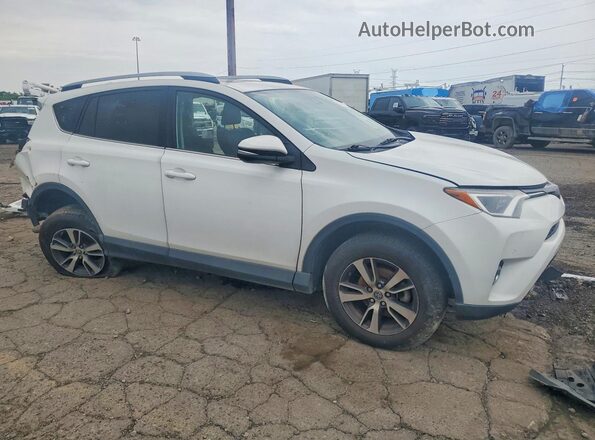2T3WFREV6JW517513 2018 TOYOTA RAV4 White Front right