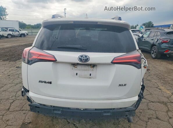 2T3WFREV6JW517513 2018 TOYOTA RAV4 White Rear view