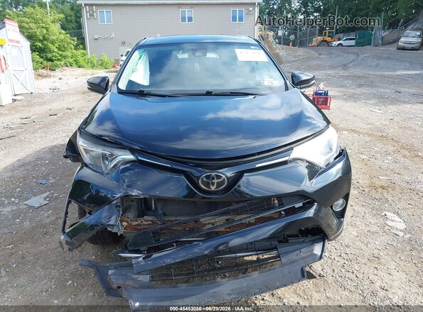 2T3WFREV7JW468371 2018 TOYOTA RAV4 Black ხელსაწყოთა პანელის ხედი