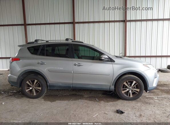 2T3WFREV8GW265367 2016 TOYOTA RAV4 Silver Rear interior view