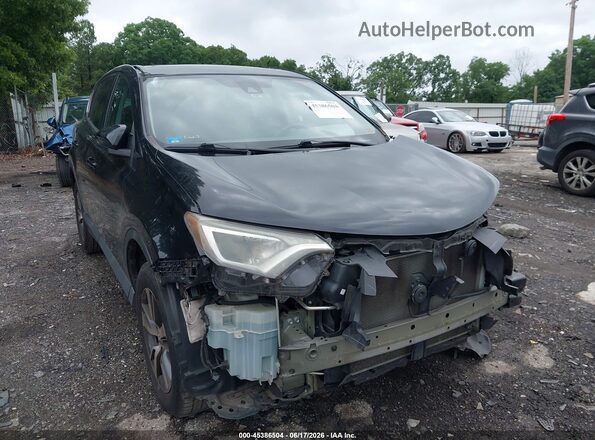 2T3WFREV8JW472316 2018 TOYOTA RAV4 Black Front view