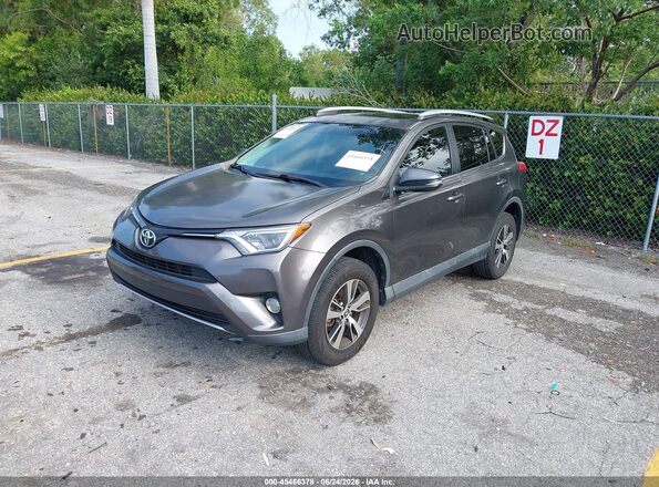 2T3WFREV9GW271162 2016 TOYOTA RAV4 Gray Vista tres cuartos delantera izquierda
