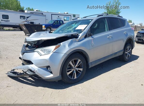 2T3WFREV9GW271288 2016 TOYOTA RAV4 Серебряный Передняя левая четверть