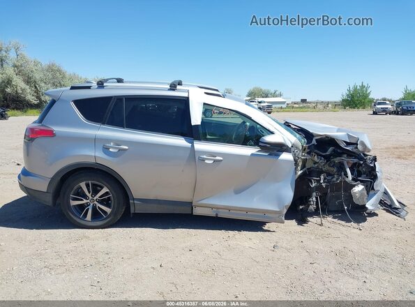2T3WFREV9GW271288 2016 TOYOTA RAV4 Серебряный Вид задней части салона