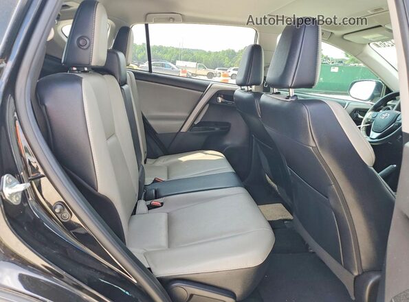2T3YFREV2JW429714 2018 TOYOTA RAV4 Black Rear interior view