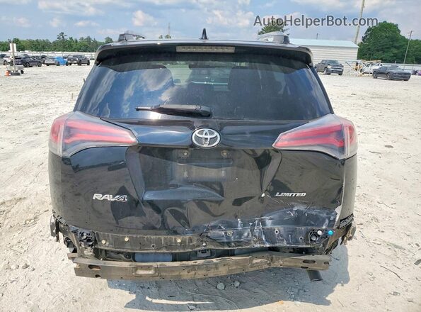2T3YFREV2JW429714 2018 TOYOTA RAV4 Black Rear view