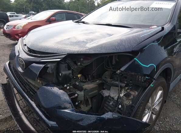 2T3YFREV5JW461654 2018 TOYOTA RAV4 Blue Front view