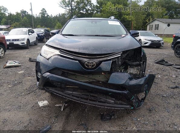 2T3YFREV5JW461654 2018 TOYOTA RAV4 Blue Rear interior view