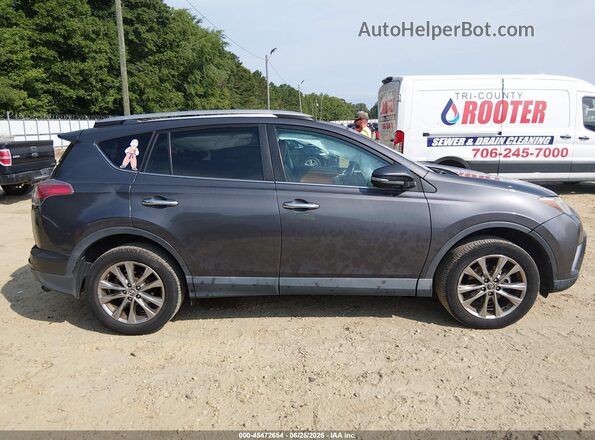 2T3YFREV7GW255986 2016 TOYOTA RAV4 Gray Rear interior view