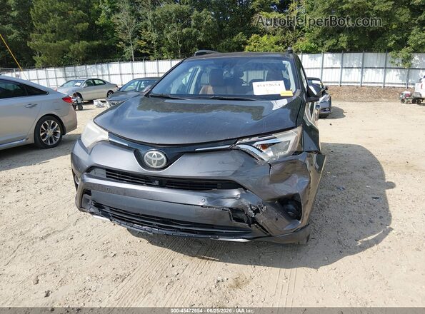 2T3YFREV7GW255986 2016 TOYOTA RAV4 Gray Front view