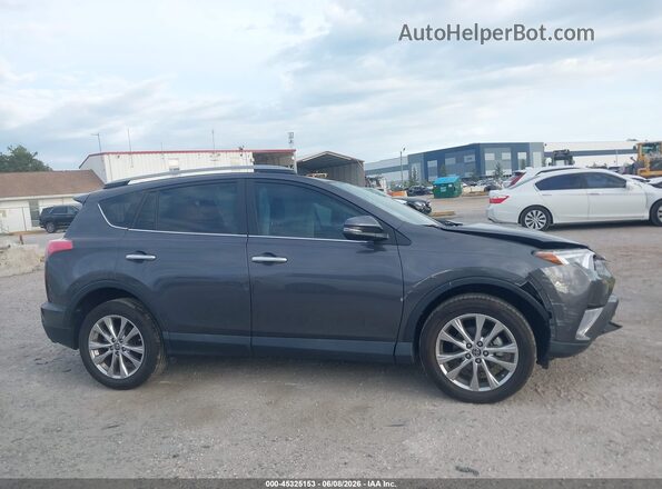 2T3YFREV8JW444394 2018 TOYOTA RAV4 Gray Սալոնի հետևի տեսք