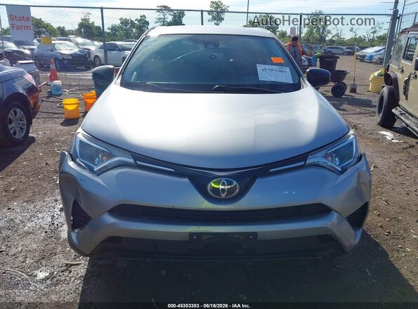 2T3ZFREV0JW466037 2018 TOYOTA RAV4 Silver Vista interior trasera