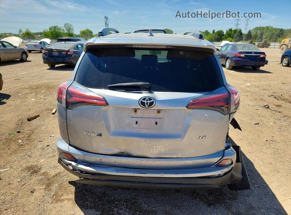2T3ZFREV2HW345441 2017 TOYOTA RAV4 Silver Vista trasera