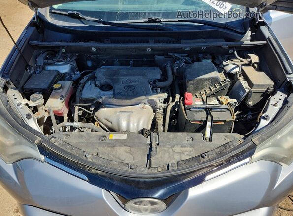 2T3ZFREV2HW345441 2017 TOYOTA RAV4 Silver Vista interior trasera